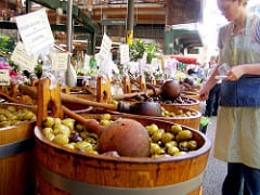 Selling olives at the Borough Market in London - Quirky Things to Do in London