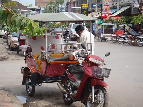 A tuk tuk driver in Siem Reap, Cambodia - Is Tourism in Cambodia Good for the Country?