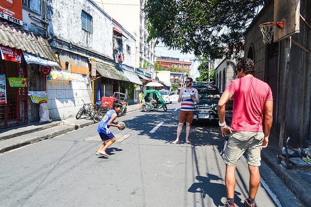 Playing Basket Ball With a Kid in Manila - Should You Visit Manila?