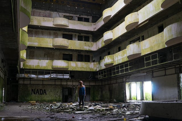 A Woman in An Empty Abandoned Building - Don't Quit Your Job to Travel